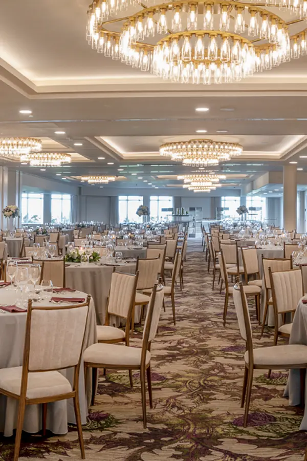 Grand ballroom with chandeliers and banquet setup