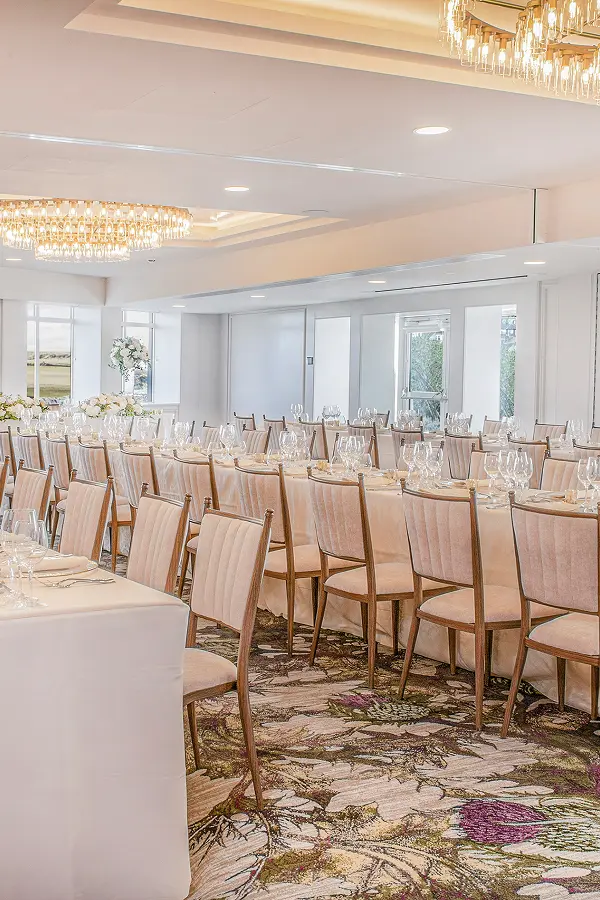 Elegant banquet hall with crystal chandeliers and floral carpet